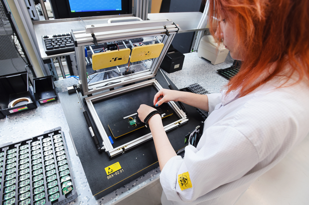 Engineer inspecting electronics